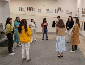A team of teachers begin their day in a morning meeting before students arrive. 